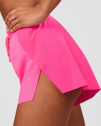 Woman wearing Accelerate 3" High-Rise Running Short - Sugar Plum | Set:true | Angle:side | Model:Bianca | Size:S | Thumbnail Index: 1