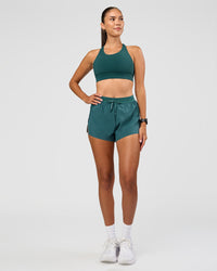 Woman wearing Accelerate 3" High-Rise Running Short - Transformative Teal | Model: Rhiley | Size:S | Thumbnail Index: 2