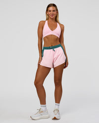 Woman wearing Accelerate 3" High-Rise Running Short - Transformative Teal-Marshmallow | Model:Amity | Size:S | Thumbnail Index: 5