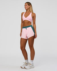 Woman wearing Accelerate 3" High-Rise Running Short - Transformative Teal-Marshmallow | Model:Amity | Size:S | Thumbnail Index: 2