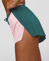 Woman wearing Accelerate 3" High-Rise Running Short - Transformative Teal-Marshmallow | Model:Amity | Size:S | Thumbnail Index: 1