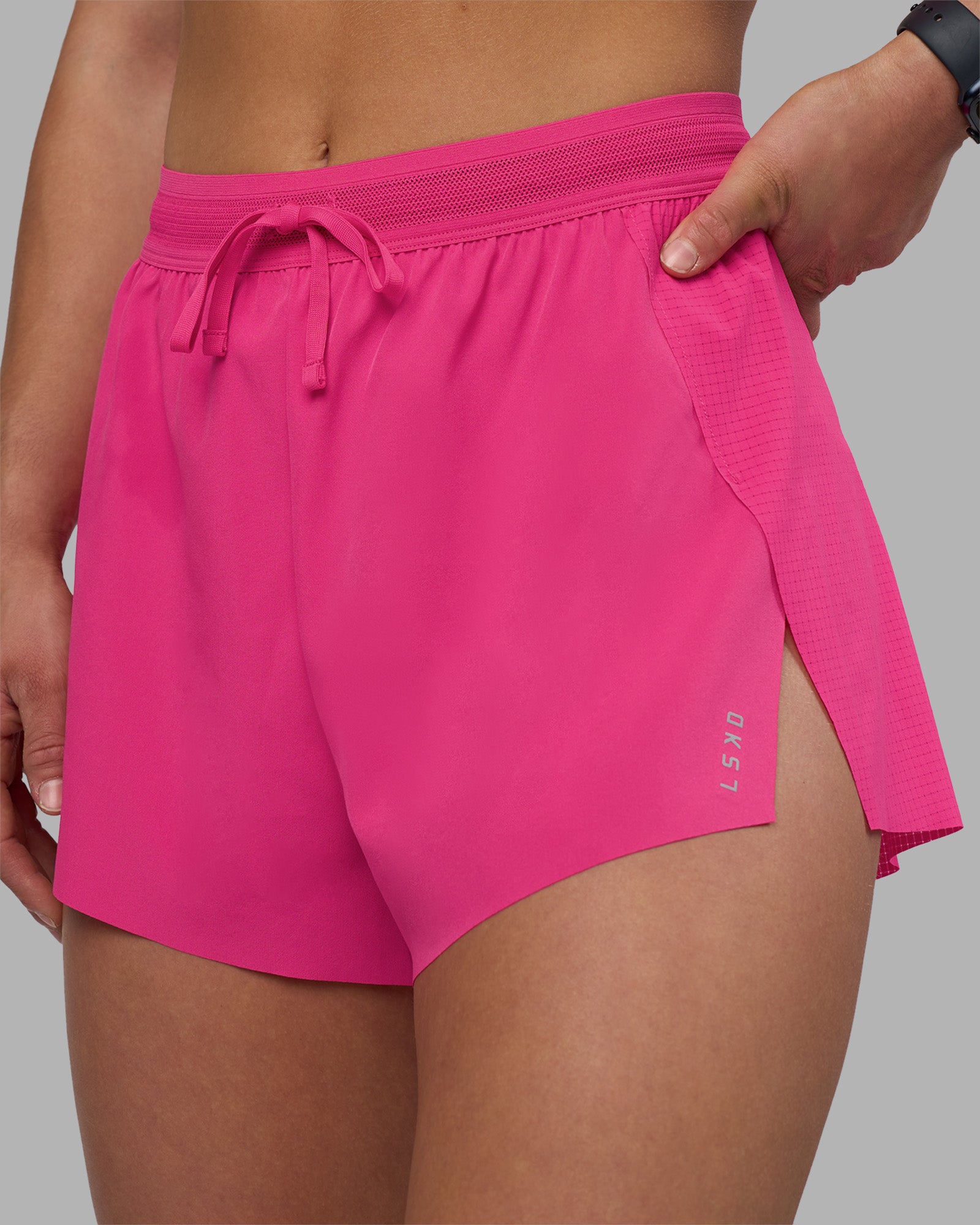 Woman wearing Accelerate 3" High-Rise Running Short - Ultra Pink | Set:true | Angle:closeup | Model:Keisha | Size:S