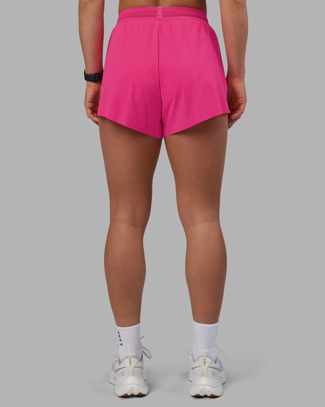 Woman wearing Accelerate 3" High-Rise Running Short - Ultra Pink | Set:true | Angle:back | Model:Keisha | Size:S - view 4
