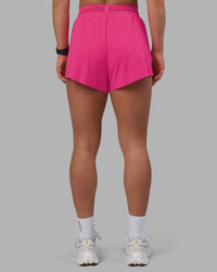 Woman wearing Accelerate 3" High-Rise Running Short - Ultra Pink | Set:true | Angle:back | Model:Keisha | Size:S | Thumbnail Index: 3