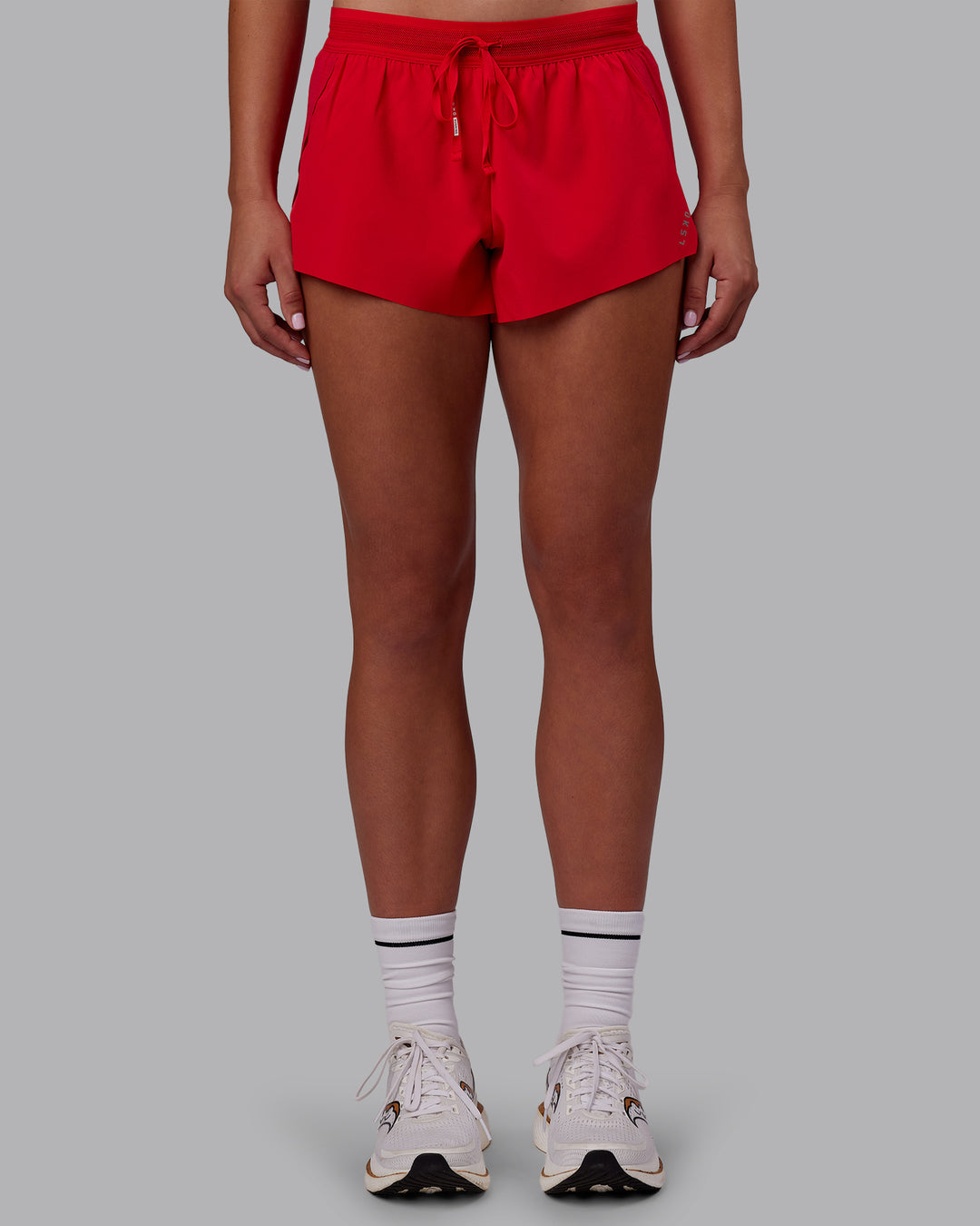 Woman wearing Accelerate Run Shorts - Scarlet | Set:true | Angle:front | Model:Charlize | Size:S - view 1