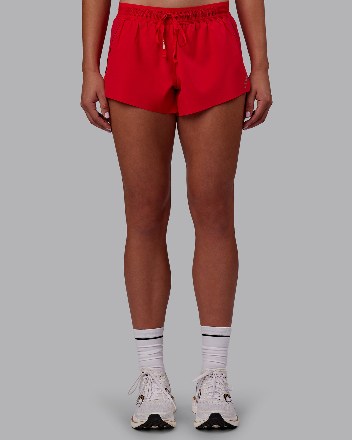 Woman wearing Accelerate Run Shorts - Scarlet | Set:true | Angle:front | Model:Charlize | Size:S