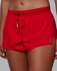 Woman wearing Accelerate Run Shorts - Scarlet | Set:true | Angle:closeup | Model:Charlize | Size:S | Thumbnail Index: 8