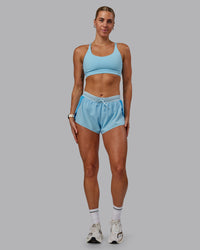Woman wearing Accelerate 3" Run Shorts - Sky Blue Colourblock | Thumbnail Index: 2