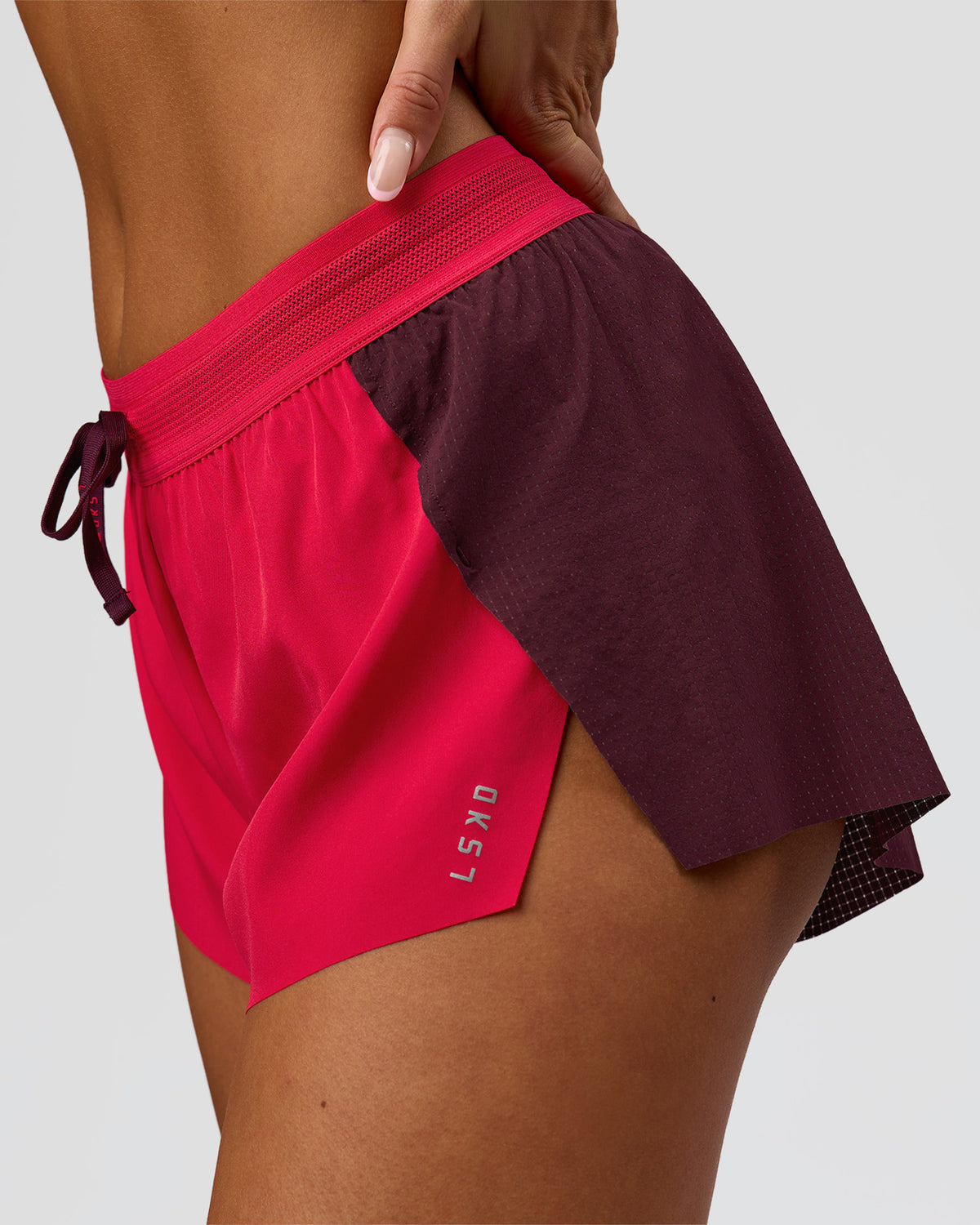 Woman wearing Accelerate 3" Mid-Rise Running Short - Cherry Lacquer-Scarlet | Model:Bianca | Size:S |