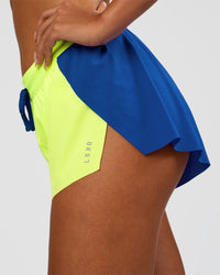 Woman wearing Accelerate 3" Mid-Rise Running Short - Electric Indigo-Lime Glo | Model:Ruby | Size:S | Thumbnail Index: 9