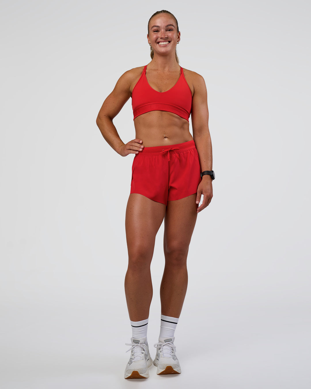Woman wearing Accelerate 3" Mid-Rise Running Short - Flame | Model:Sav | Size:S - view 2