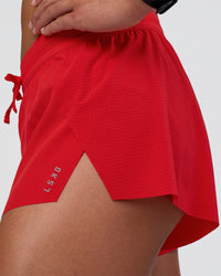 Woman wearing Accelerate 3" Mid-Rise Running Short - Flame | Model:Sav | Size:S | Thumbnail Index: 5