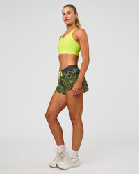 Woman wearing Accelerate 3" Mid-Rise Running Short - Friction Print Hyper Green | Model:Emelia | Size:S | Thumbnail Index: 8