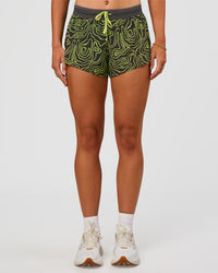 Woman wearing Accelerate 3" Mid-Rise Running Short - Friction Print Hyper Green | Set:true | Angle:front | Model:Emelia | Size:S | Thumbnail Index: 1