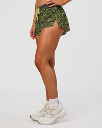 Woman wearing Accelerate 3" Mid-Rise Running Short - Friction Print Hyper Green | Set:true | Angle:side | Model:Emelia | Size:S | Thumbnail Index: 7