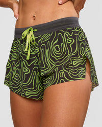 Woman wearing Accelerate 3" Mid-Rise Running Short - Friction Print Hyper Green | Set:true | Angle:closeup | Model:Emelia | Size:S | Thumbnail Index: 9