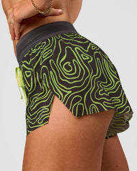 Woman wearing Accelerate 3" Mid-Rise Running Short - Friction Print Hyper Green | Model:Emelia | Size:S | Thumbnail Index: 5