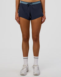 Woman wearing Accelerate 3" Mid-Rise Running Short - Future Navy-Baltic Sea | Set:true | Angle:front | Model:Evie | Size:S | Thumbnail Index: 2