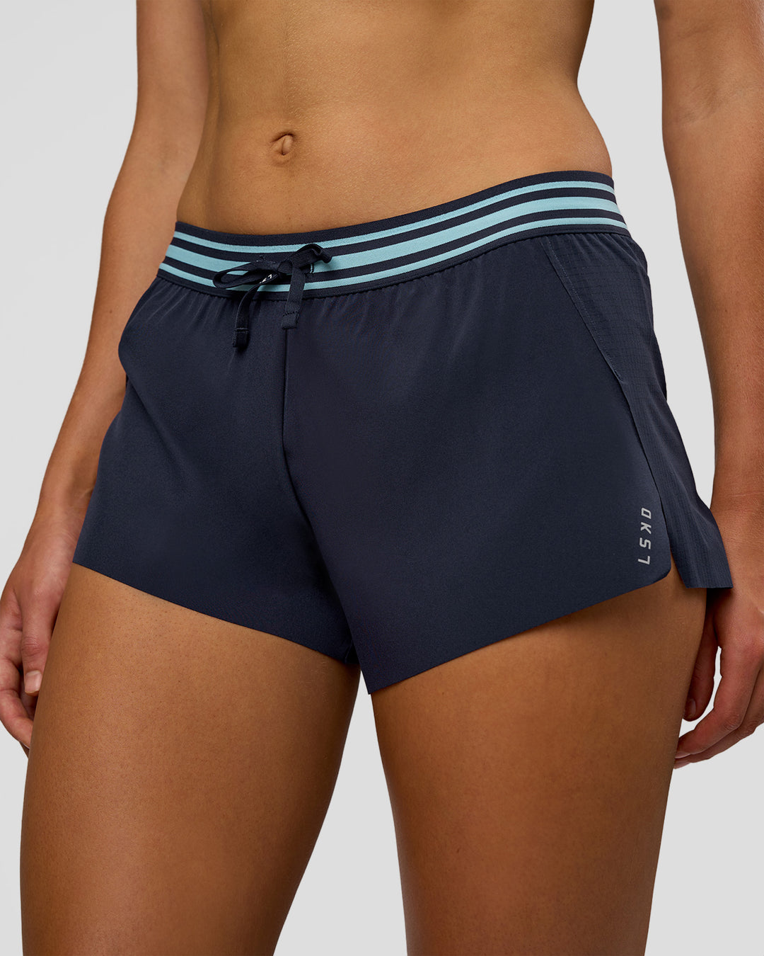 Woman wearing Accelerate 3" Mid-Rise Running Short - Future Navy-Baltic Sea | Set:true | Angle:closeup | Model:Evie | Size:S - view 4