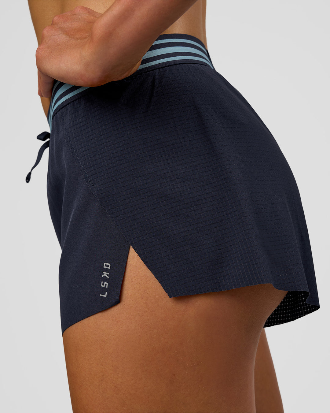 Woman wearing Accelerate 3" Mid-Rise Running Short - Future Navy-Baltic Sea | Model:Evie | Size:S - view 11
