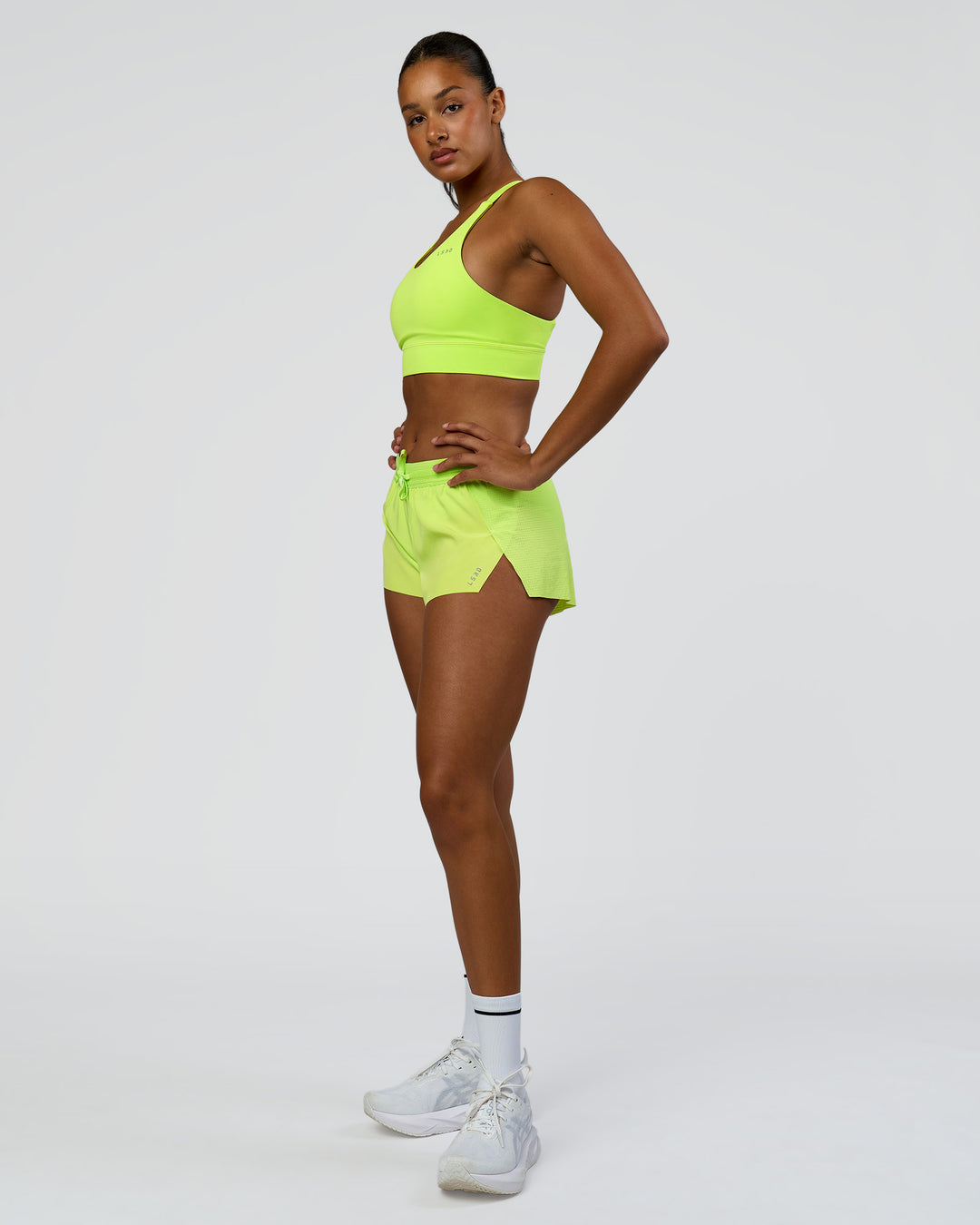 Woman wearing Accelerate 3" Mid-Rise Running Short - Hyper Green | Model:Rosie | Size:S - view 8