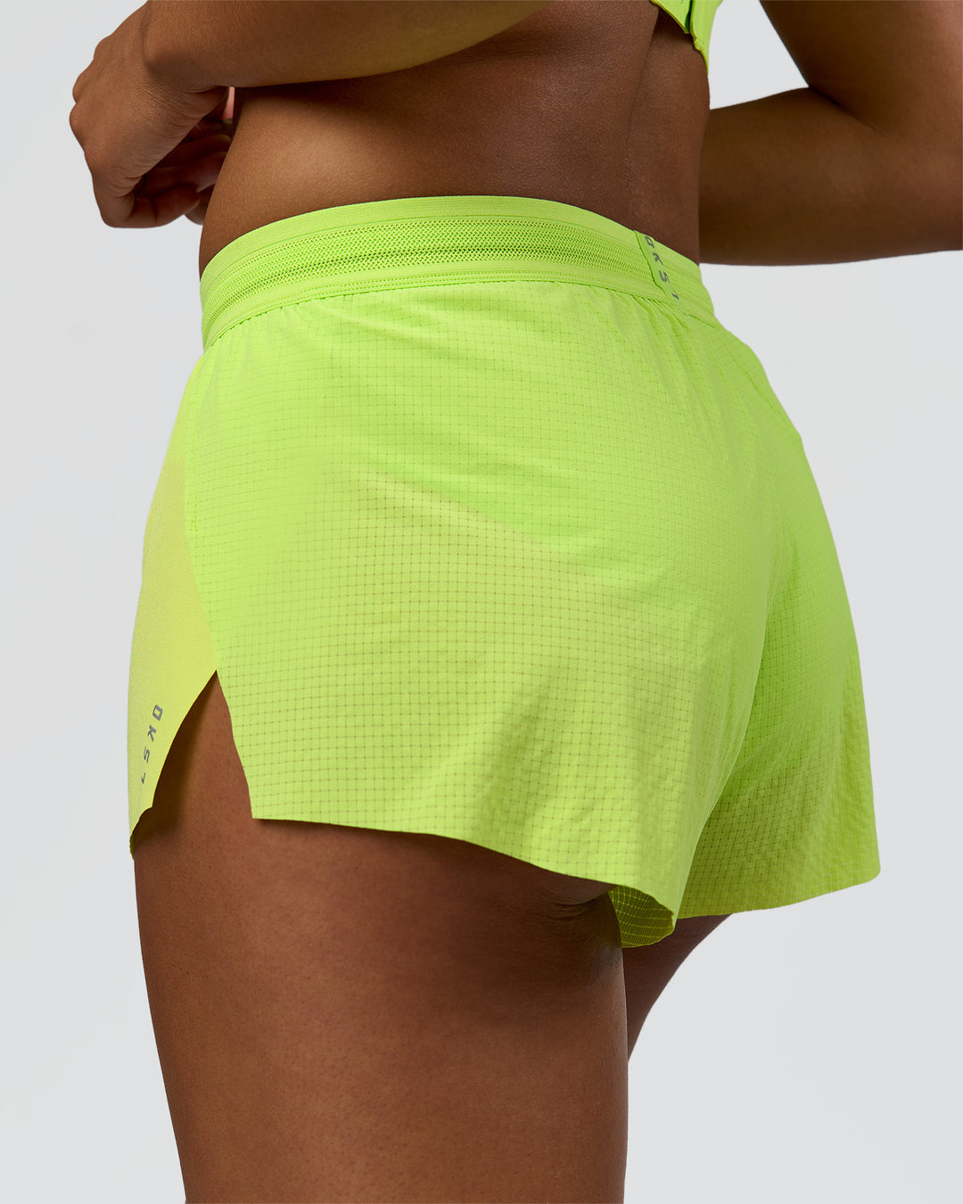 Woman wearing Accelerate 3" Mid-Rise Running Short - Hyper Green | Model:Rosie | Size:S - view 3
