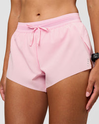 Woman wearing Accelerate 3" Mid-Rise Running Short - Marshmallow | Set:true | Angle:closeup | Model:Rhiley | Size:S | Thumbnail Index: 1
