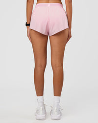 Woman wearing Accelerate 3" Mid-Rise Running Short - Marshmallow | Set:true | Angle:back | Model:Rhiley | Size:S | Thumbnail Index: 2