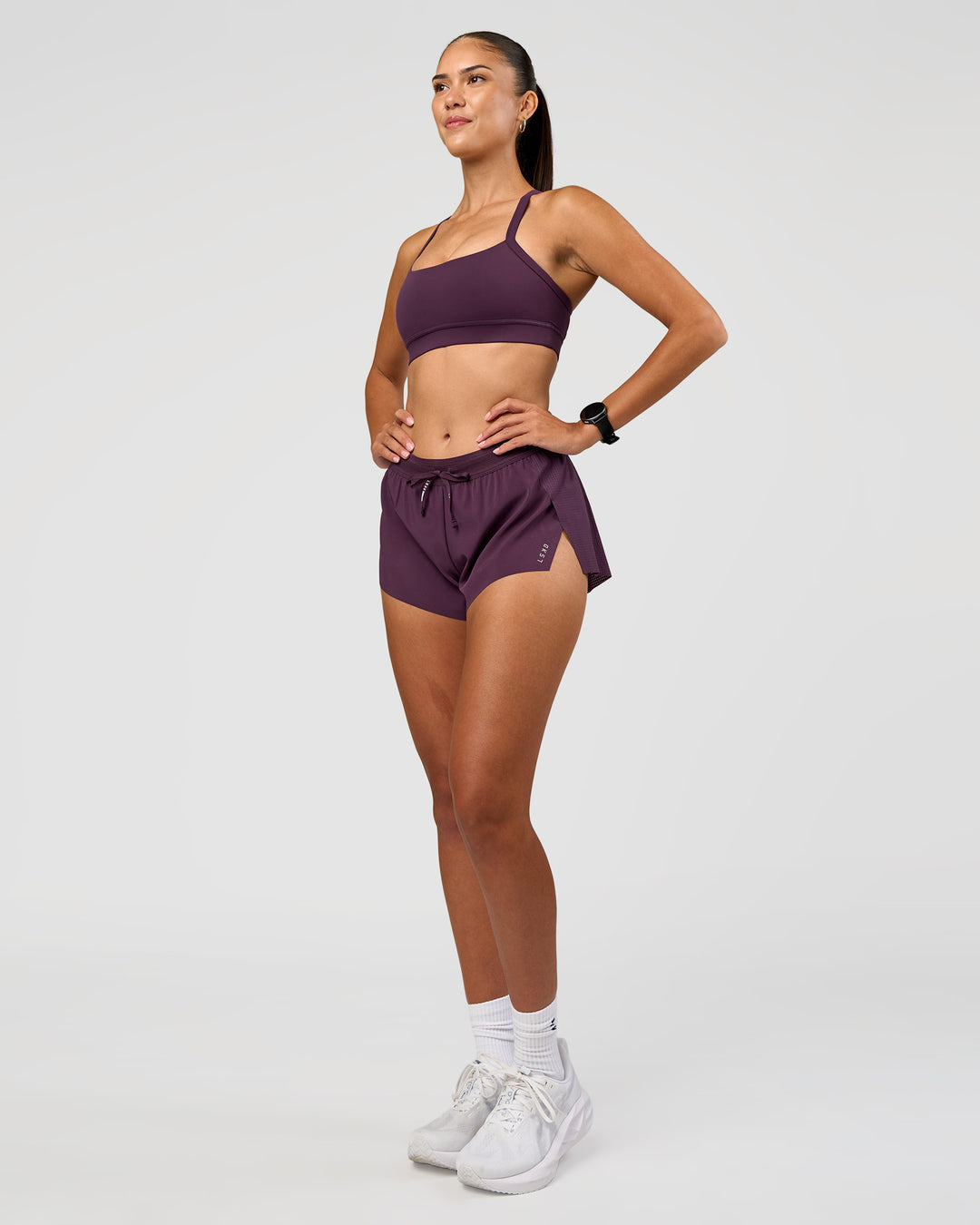 Woman wearing Accelerate 3" Mid-Rise Running Short - Midnight Plum | Model:Rhiley | Size:S - view 10