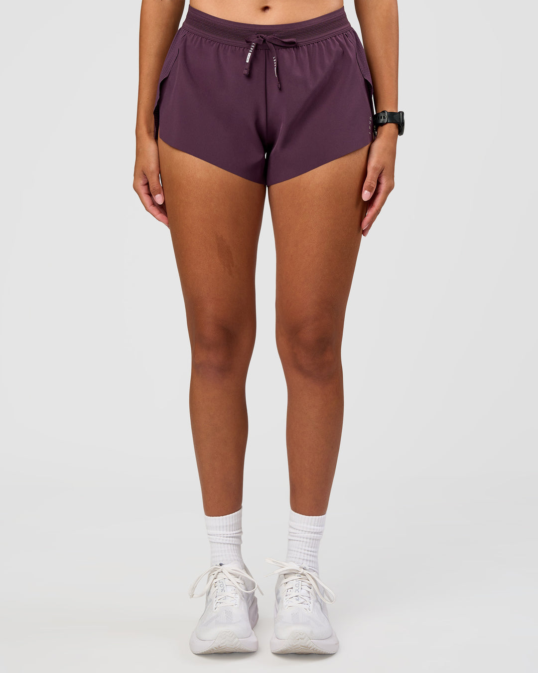 Woman wearing Accelerate 3" Mid-Rise Running Short - Midnight Plum | Set:true | Angle:front | Model:Rhiley | Size:S - view 8