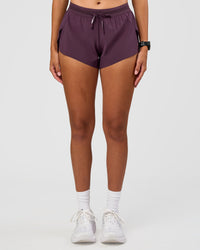 Woman wearing Accelerate 3" Mid-Rise Running Short - Midnight Plum | Set:true | Angle:front | Model:Rhiley | Size:S | Thumbnail Index: 7