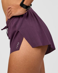 Woman wearing Accelerate 3" Mid-Rise Running Short - Midnight Plum | Model:Rhiley | Size:S | Thumbnail Index: 1