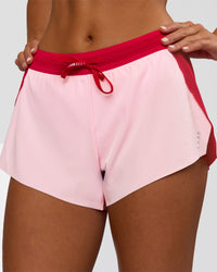 Woman wearing Accelerate 3" Mid-Rise Running Short - Scarlet-Marshmallow | Set:true | Angle:closeup | Model:Amity | Size:S | Thumbnail Index: 6