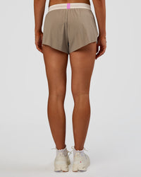 Woman wearing Accelerate 3" Mid-Rise Running Short - Taupe Ash-Glacial Blue | Set:true | Angle:back | Model:Emelia | Size:S | Thumbnail Index: 2
