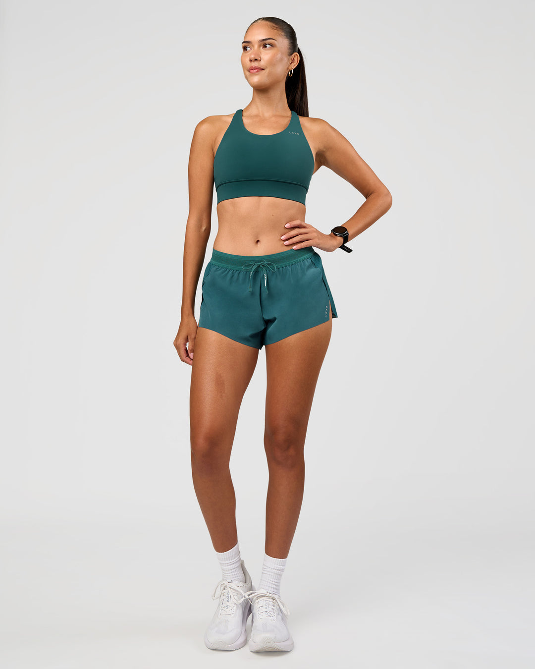 Woman wearing Accelerate 3" Mid-Rise Running Short - Transformative Teal | Model:Rhiley | Size:S - view 7