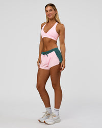 Woman wearing Accelerate 3" Mid-Rise Running Short - Transformative Teal-Marshmallow | Model:Amity | Size:S | Thumbnail Index: 7