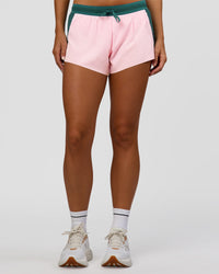 Woman wearing Accelerate 3" Mid-Rise Running Short - Transformative Teal-Marshmallow | Set:true | Angle:front | Model:Amity | Size:S | Thumbnail Index: 5