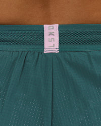 Woman wearing Accelerate 3" Mid-Rise Running Short - Transformative Teal-Marshmallow | Model:Amity | Size:S | Thumbnail Index: 9
