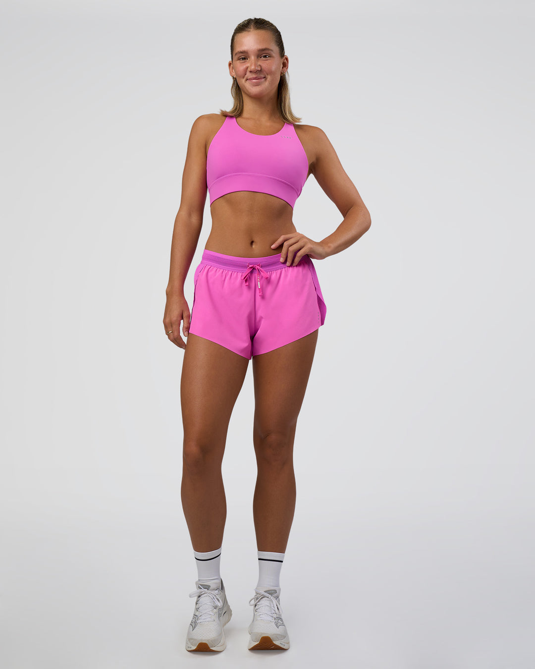 Woman wearing Accelerate 3" Mid-Rise Running Short - Ultra Fuchsia | Model:Amity | Size:S - view 2