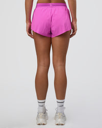 Woman wearing Accelerate 3" Mid-Rise Running Short - Ultra Fuchsia | Set:true | Angle:back | Model:Amity | Size:S | Thumbnail Index: 2