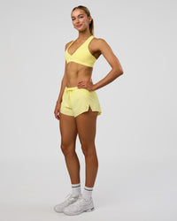 Woman wearing Accelerate 3" Mid-Rise Running Short - Yellow Fizz | Model:Evie | Size:S | Thumbnail Index: 6