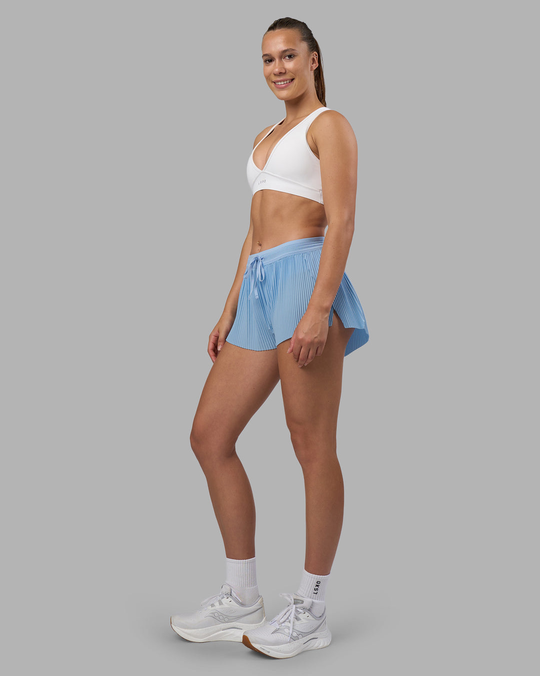 Woman wearing Accelerate 3" Pleated Running Short - Open Air | Model:Charlize | Size:S - view 7