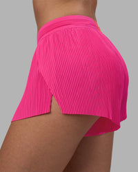 Woman wearing Accelerate 3" Pleated Running Short - Ultra Pink | Model:Rhiley | Size:S | Thumbnail Index: 8