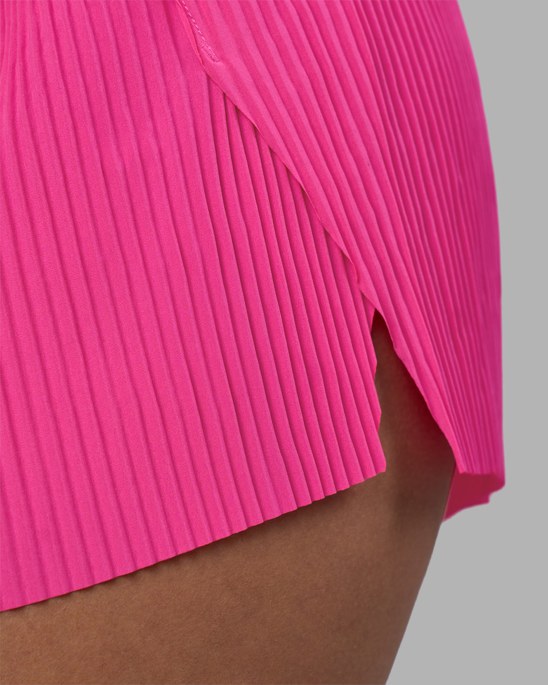 Woman wearing Accelerate 3" Pleated Running Short - Ultra Pink | Model:Rhiley | Size:S - view 12