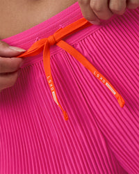 Woman wearing Accelerate 3" Pleated Running Short - Ultra Pink | Model:Rhiley | Size:S | Thumbnail Index: 7