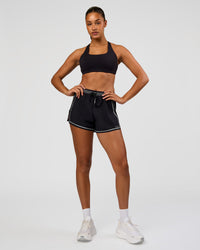 Woman wearing Accelerate 3" Reflective High-Rise Running Short - Black-Reflective | Model:Rosie | Size:S | Thumbnail Index: 5