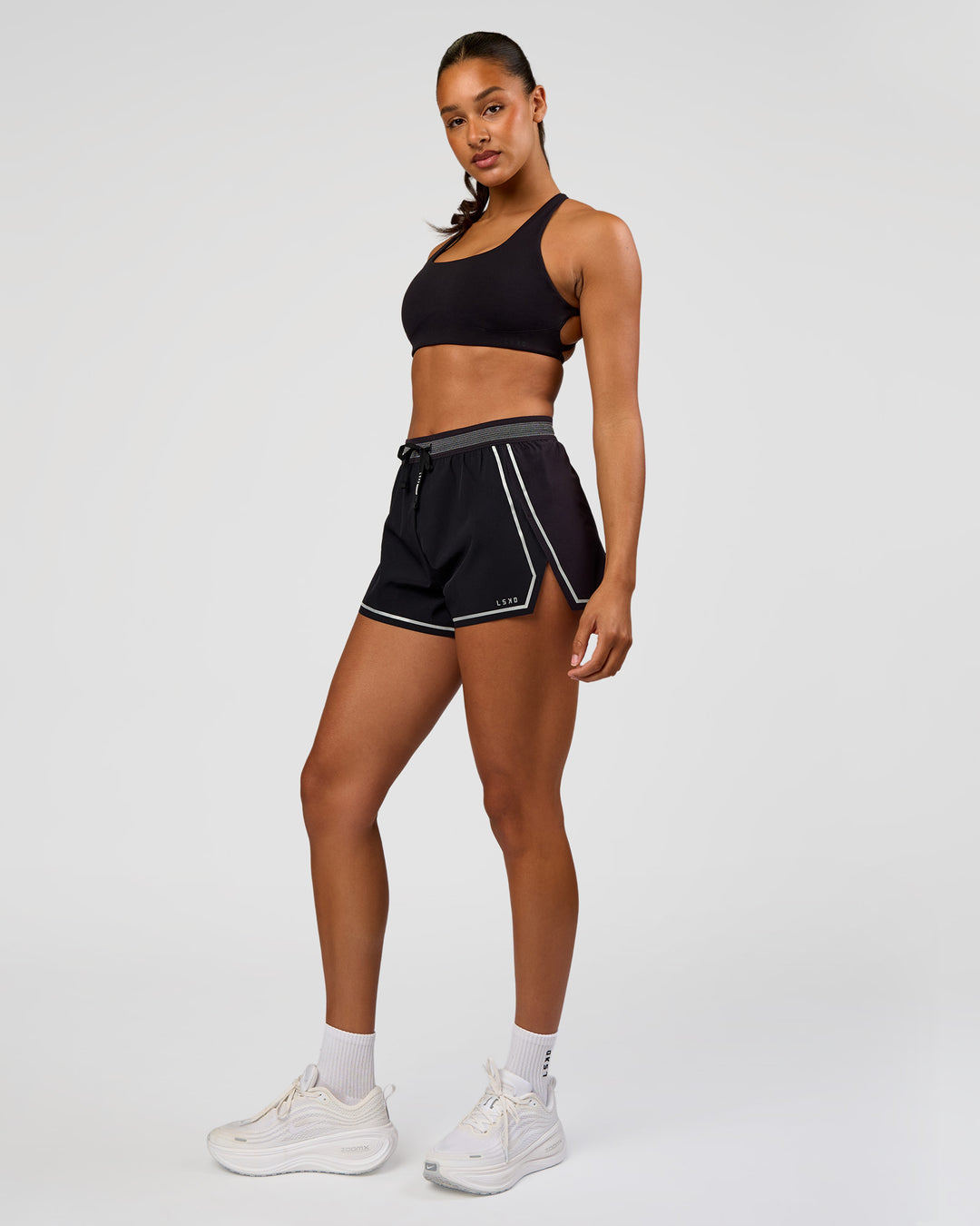 Woman wearing Accelerate 3" Reflective High-Rise Running Short - Black-Reflective | Model:Rosie | Size:S - view 7