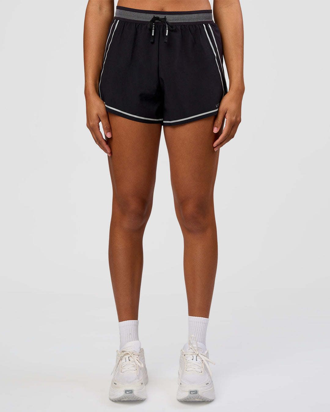 Woman wearing Accelerate 3" Reflective High-Rise Running Short - Black-Reflective | Set:true | Angle:front | Model:Rosie | Size:S - view 3