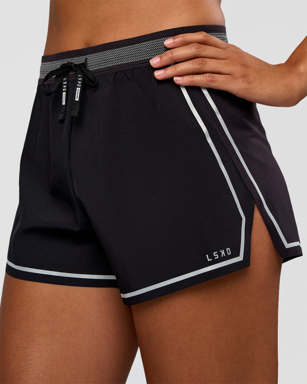Woman wearing Accelerate 3" Reflective High-Rise Running Short - Black-Reflective | Set:true | Angle:closeup | Model:Rosie | Size:S - view 5