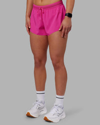 Woman wearing Accelerate 3" Running Short - Ultra Pink | Set:true | Angle:side | Model:Keisha | Size:S | Thumbnail Index: 9